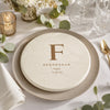 Groomsman disc golf disc used as a wedding reception place setting favor with eucalyptus and gold flatware
