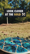 Video of the Kintsugi disc golf disc with the gloss gold veins catching sunlight