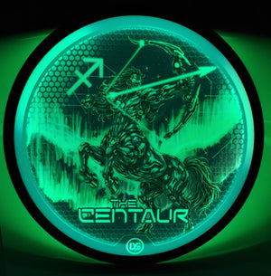 The Centaur disc glowing bright green in the dark, with the cybernetic centaur archer artwork, Sagittarius glyph, and aurora waves illuminated by the Eclipse 2.0 glow core